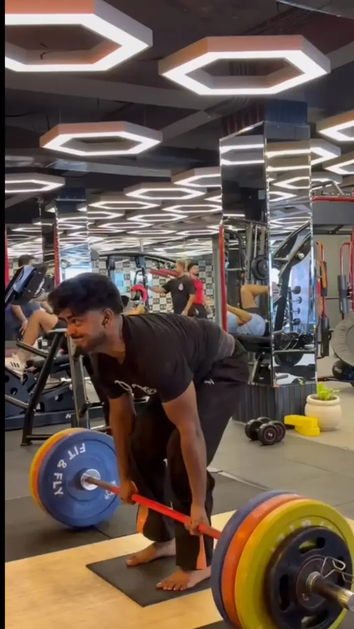 Member deadlifting on the Fit & Fly strength floor